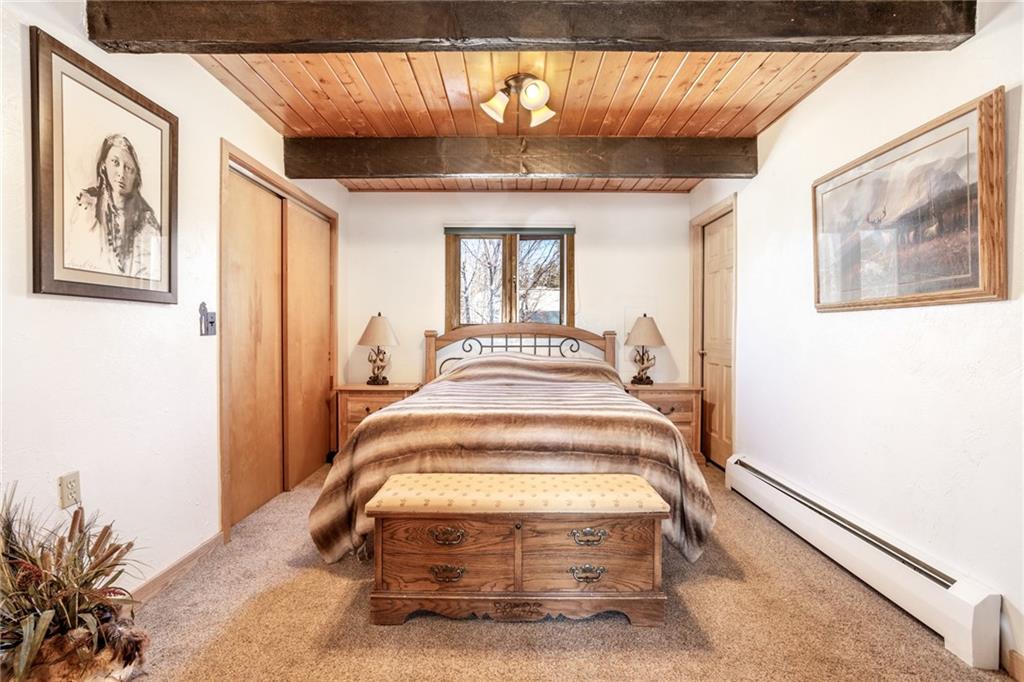567 G Road Silverthorne, CO 80498 - Photo 16 of 32 a view of a hallway with wooden floor and windows