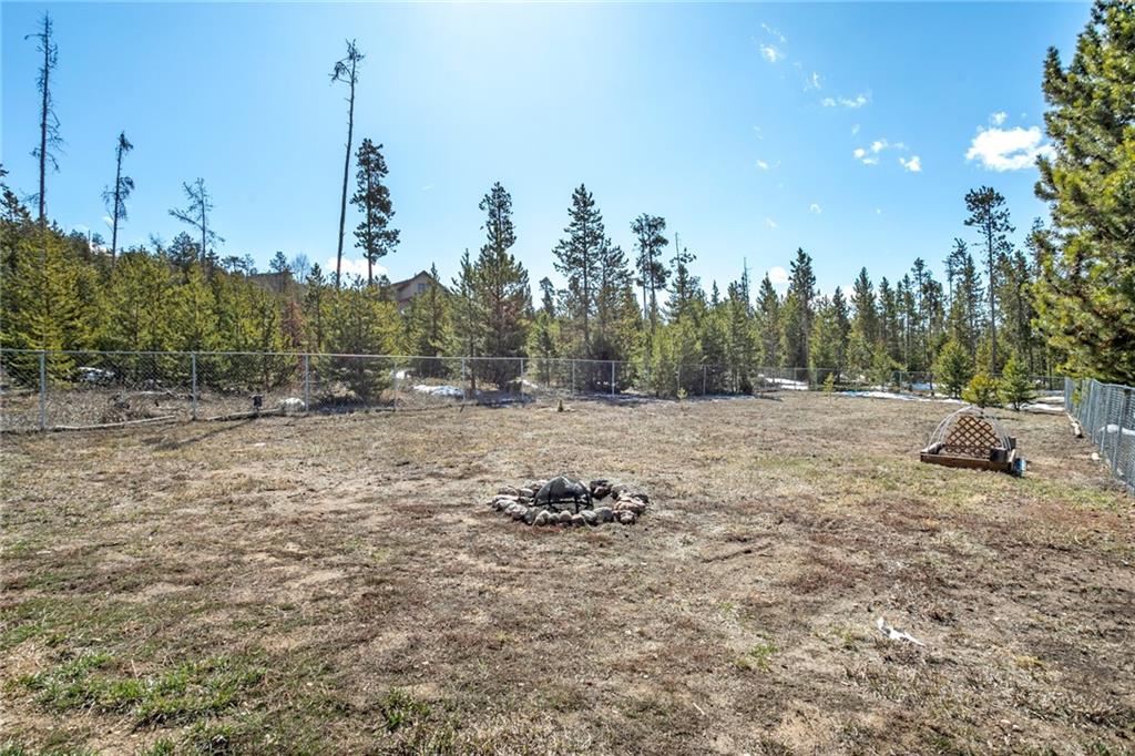567 G Road Silverthorne, CO 80498 - Photo 19 of 32 a backyard of a house with lots of green space