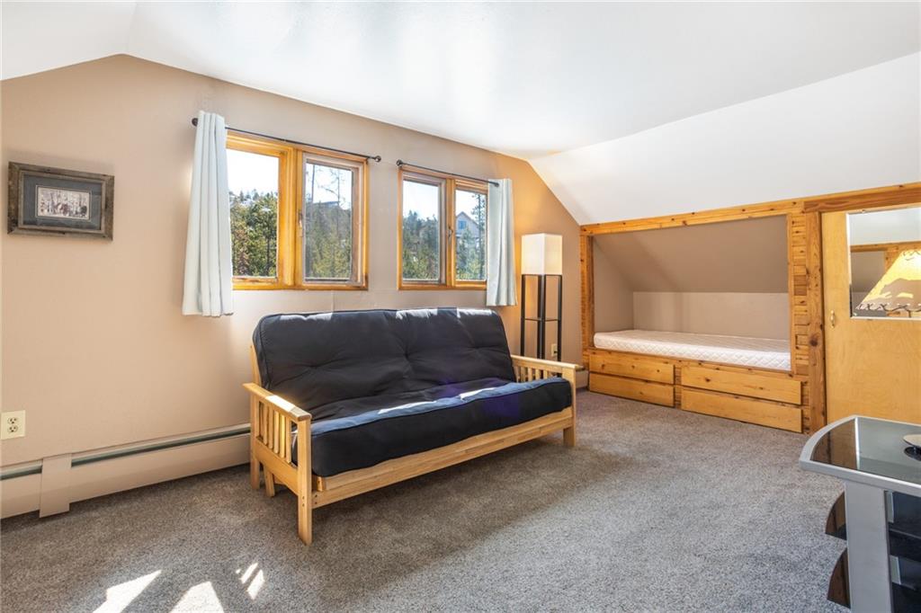 567 G Road Silverthorne, CO 80498 - Photo 23 of 32 a living room with furniture and a large window