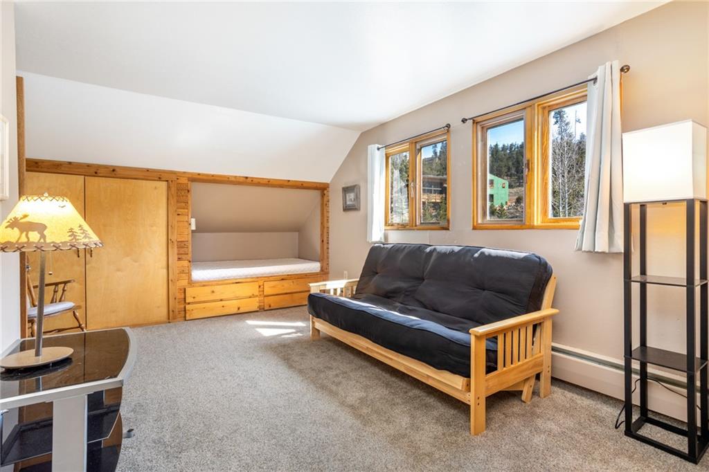 567 G Road Silverthorne, CO 80498 - Photo 24 of 32 a bedroom with furniture and a large window