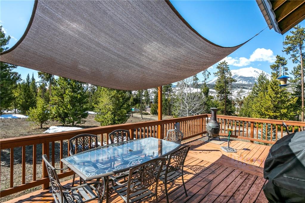 567 G Road Silverthorne, CO 80498 - Photo 26 of 32 a view of balcony with wooden floor and outdoor seating