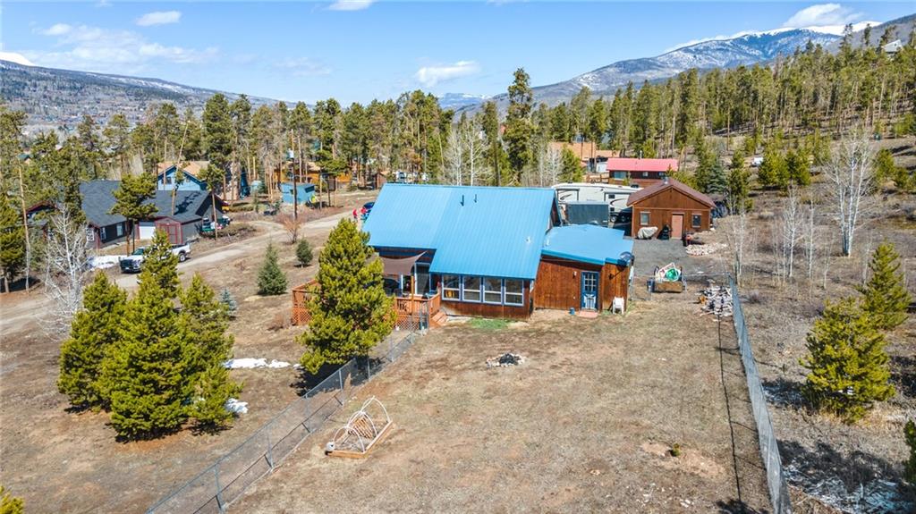 567 G Road Silverthorne, CO 80498 - Photo 4 of 32 an aerial view of a house with a yard and lake view