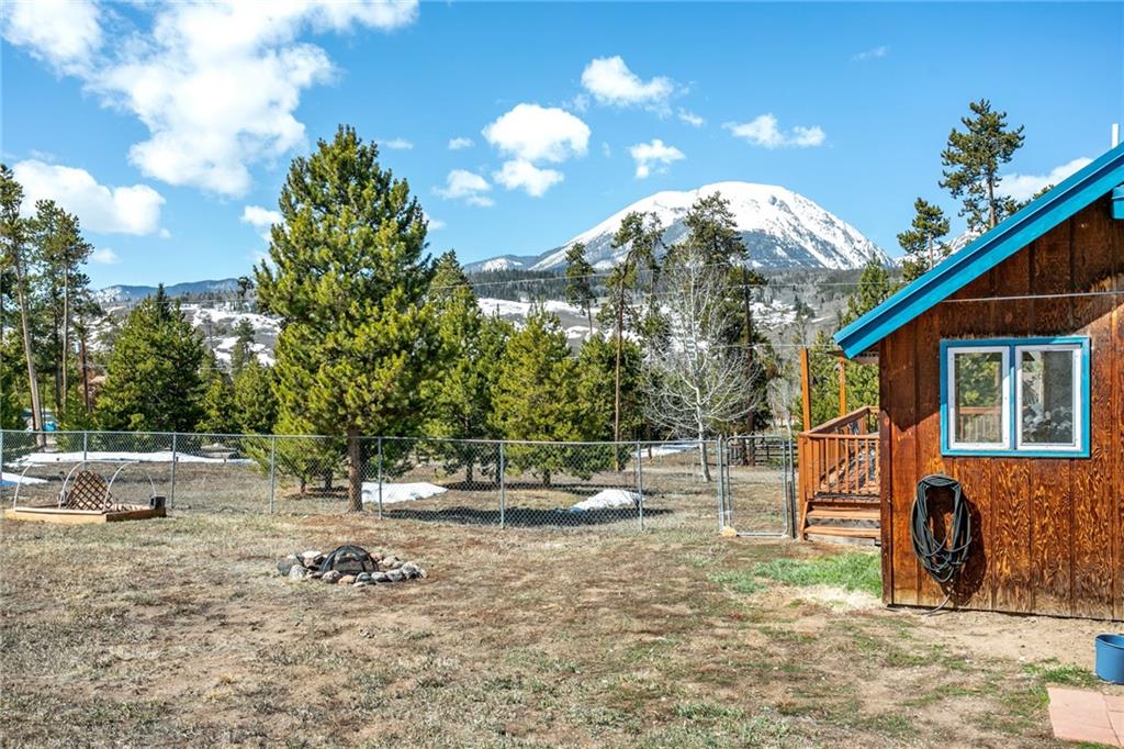 567 G Road Silverthorne, CO 80498 - Photo 31 of 32 a backyard of a house with table and chairs