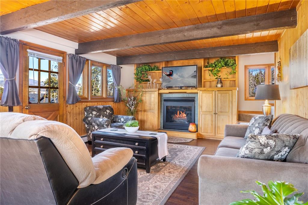 567 G Road Silverthorne, CO 80498 - Photo 5 of 32 a living room with furniture fireplace and a large window