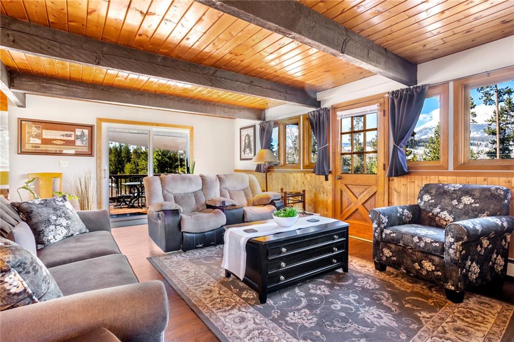 567 G Road Silverthorne, CO 80498 - Photo 6 of 32 a living room with furniture a large window and a chandelier