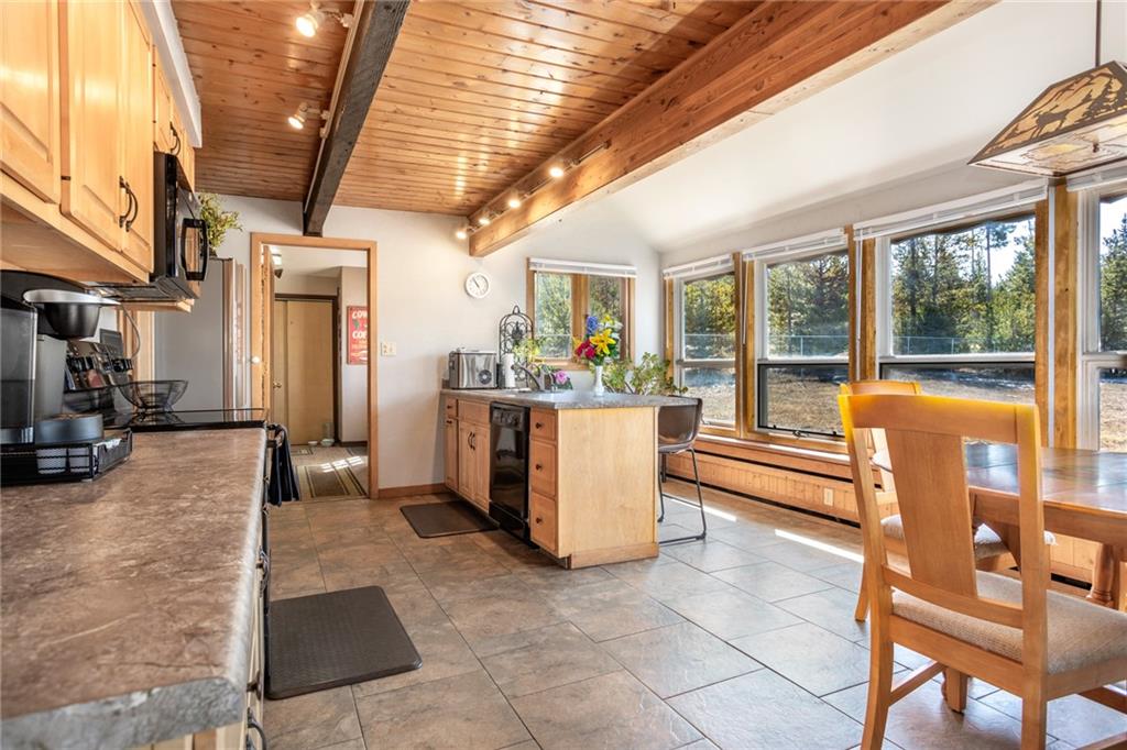 567 G Road Silverthorne, CO 80498 - Photo 8 of 32 a view of a patio with swimming pool table and chairs