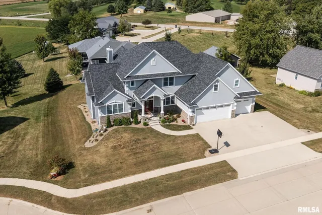 a kitchen with stainless steel appliances a refrigerator sink and microwave