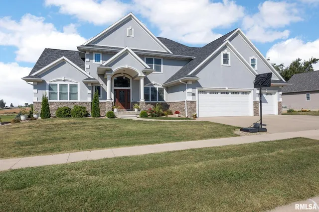 a bathroom with sink granite and a mirror