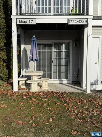 a front view of a house with a large window