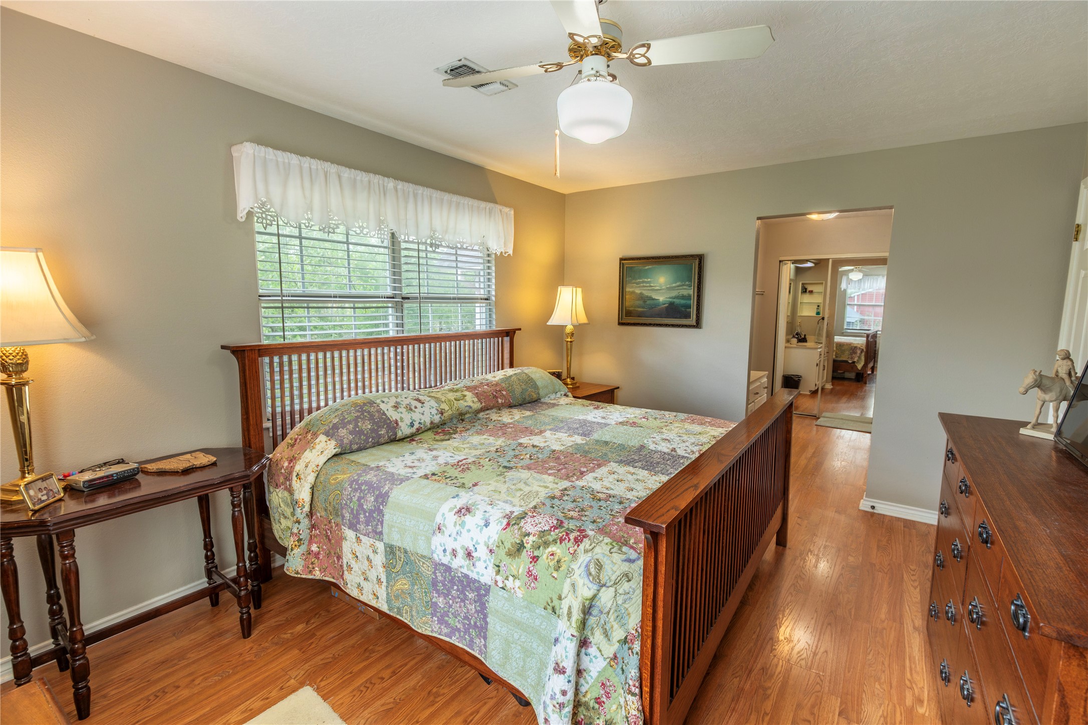 636 Deer Run Road Bellville, TX 77418 - Photo 6 of 23 a bedroom with a bed and wooden floor