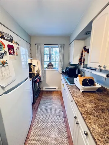 a kitchen with a stove and a refrigerator