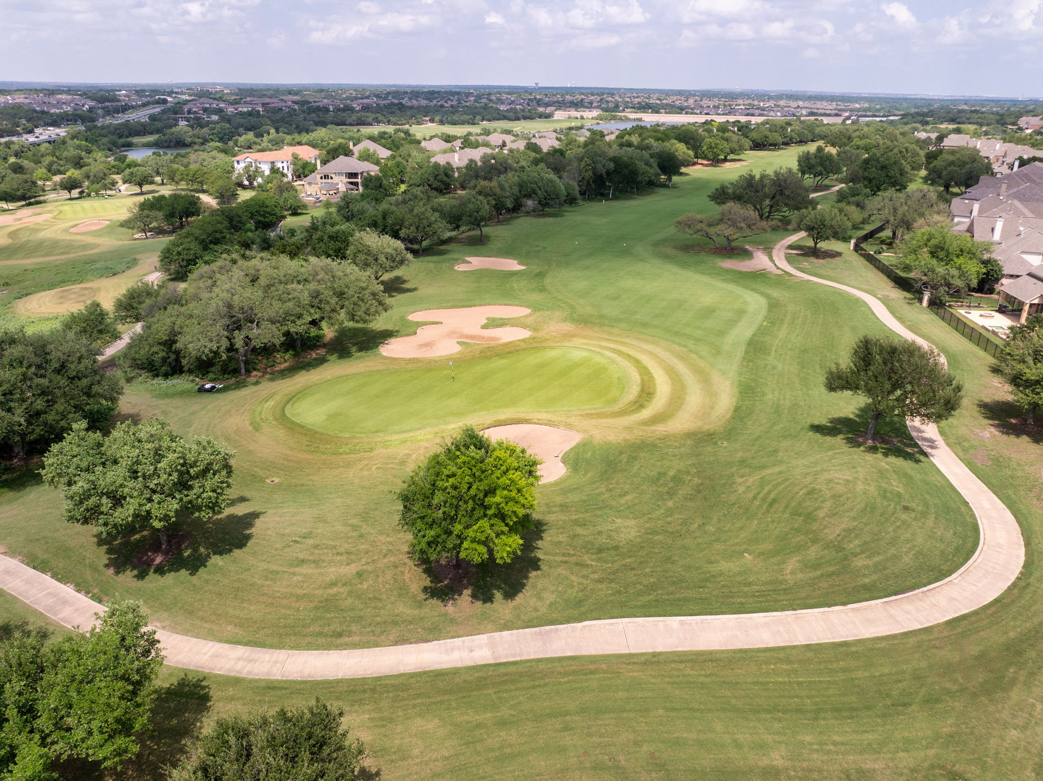 14815 Avery Ranch Boulevard, Unit 1401 Austin, TX 78717 - Photo 29 of 38 Golf course green with sand traps and manicured fairways