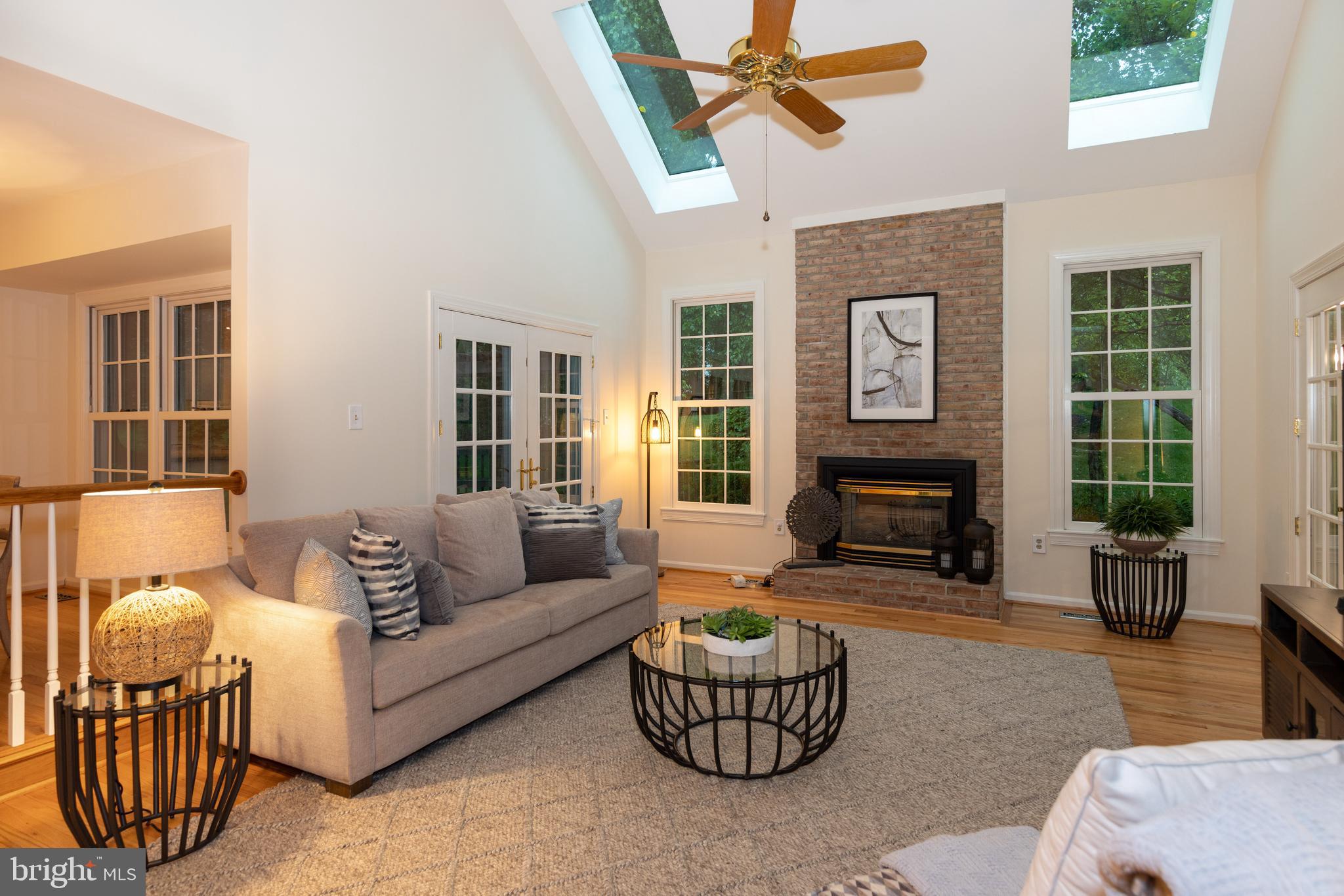 9702 Rambling Ridge Court Fairfax Station, VA 22039 - Photo 10 of 78 Vaulted family room with gas fireplace & skylights