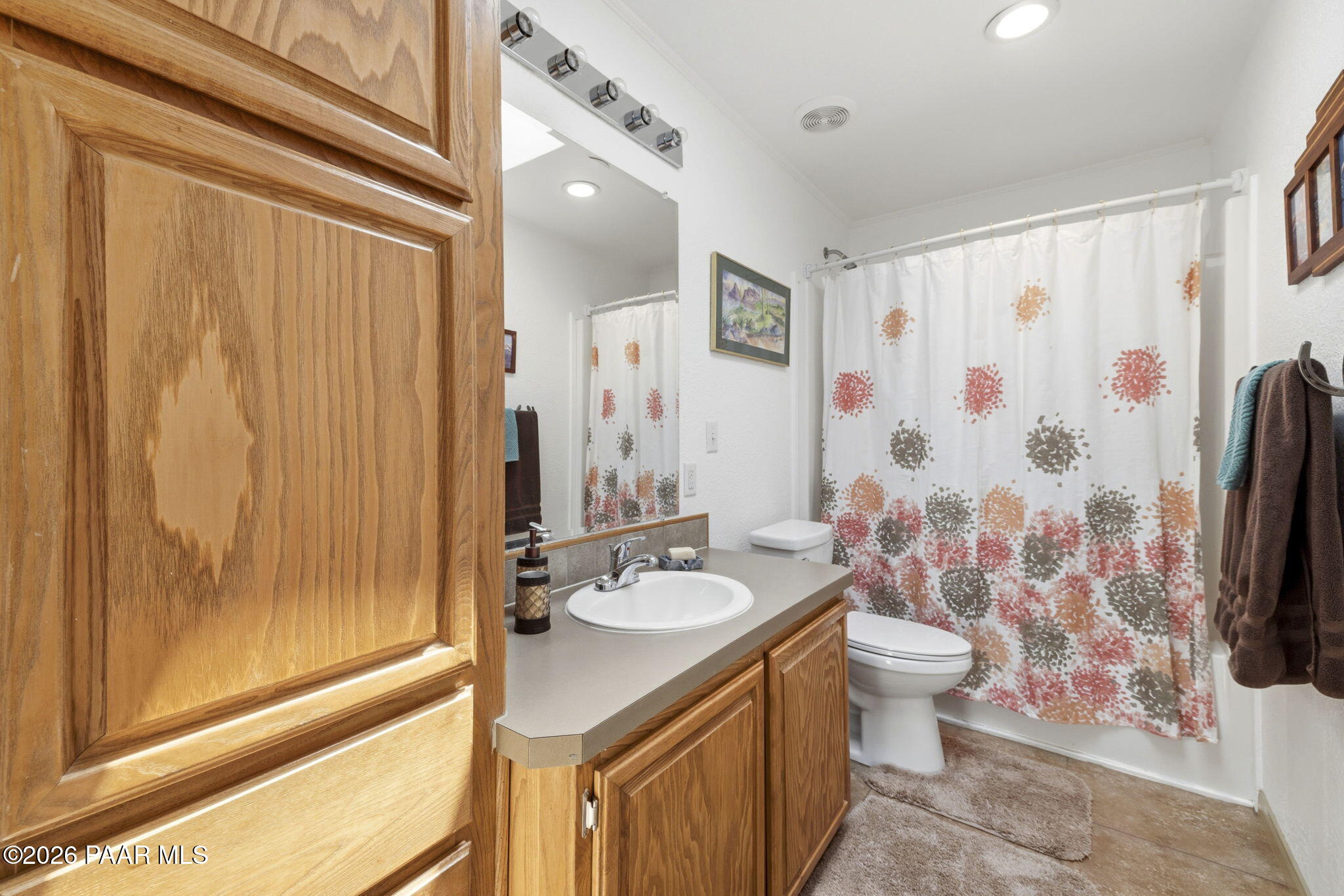 875 West Little Ranch Road Paulden, AZ 86334 - Photo 19 of 51 a bathroom with a double vanity sink toilet and shower
