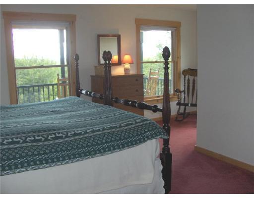 129 Old Country Road Rangeley, ME 04970 - Photo 10 of 19 Master Bedroom.