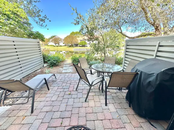 a view of a backyard with sitting area