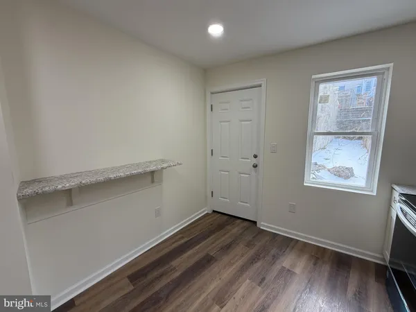 a kitchen with stainless steel appliances granite countertop a stove a refrigerator and a microwave