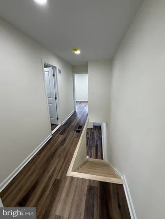 a bathroom with a shower and a sink