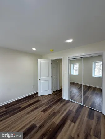 a view of a hall with wooden floor