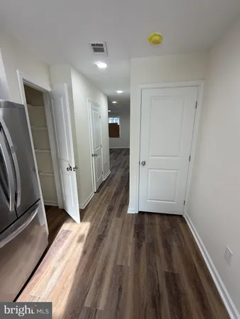 a kitchen with stainless steel appliances a refrigerator sink and microwave