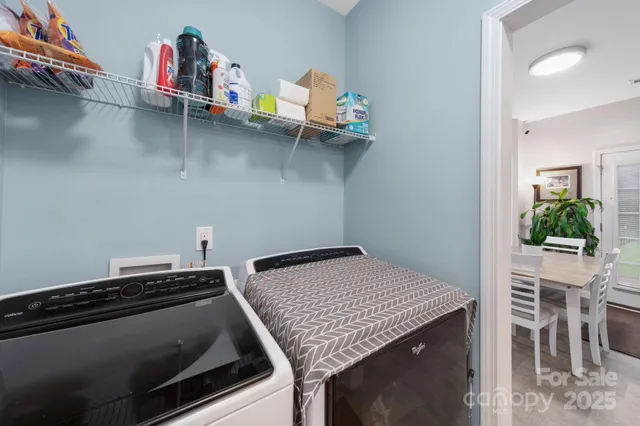 a bathroom with a granite countertop sink mirror and toilet