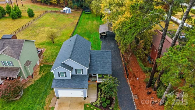 an aerial view of a house with a garden