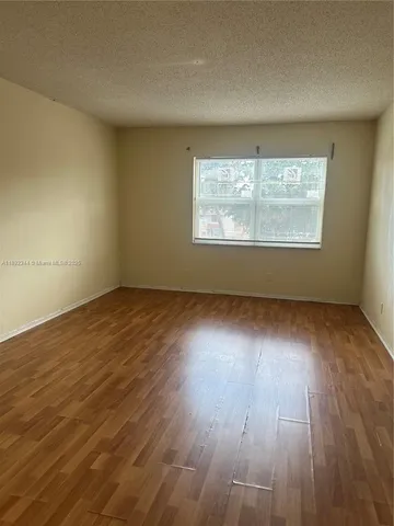 a bathroom with a granite countertop toilet sink and shower