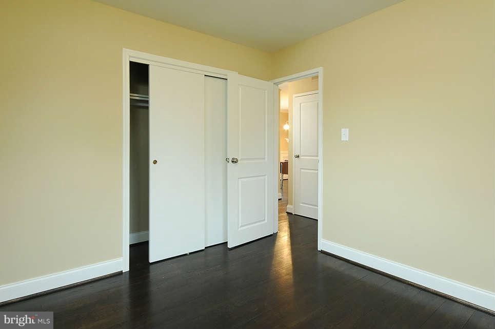 725 Crosby Road Baltimore, MD 21228 - Photo 14 of 24 a view of an empty room with wooden floor