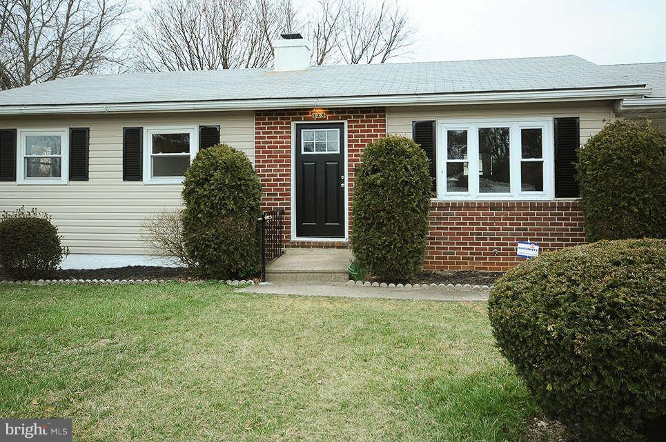 725 Crosby Road Baltimore, MD 21228 - Photo 22 of 24 a front view of a house with a garden