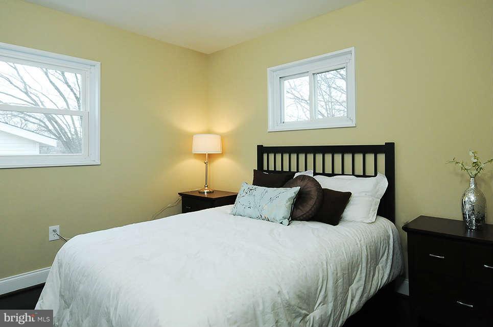 725 Crosby Road Baltimore, MD 21228 - Photo 5 of 24 a bedroom with a bed and window