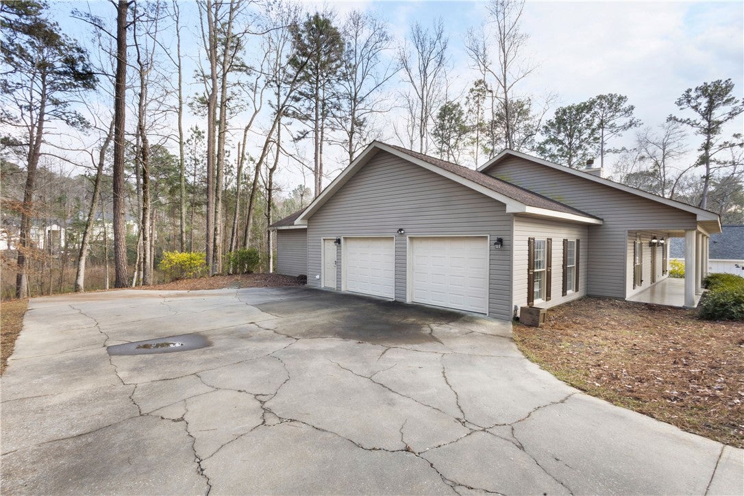 561 Lakeview Ridge Circle Dadeville, AL 36853 - Photo 6 of 28 HUGE garage approx 596sf which includes space for cars and a storage room