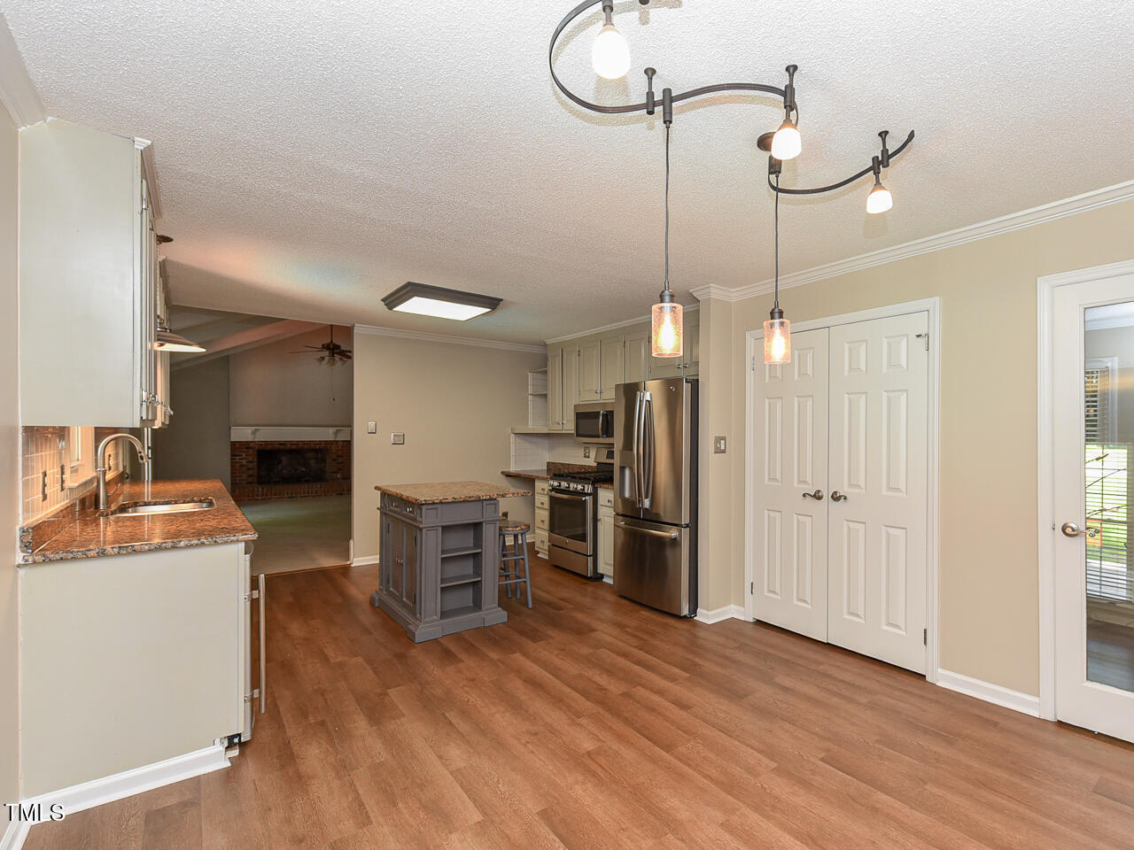 1215 Brookgreen Drive Cary, NC 27511 - Photo 19 of 40 a view of a kitchen with a refrigerator and a stove