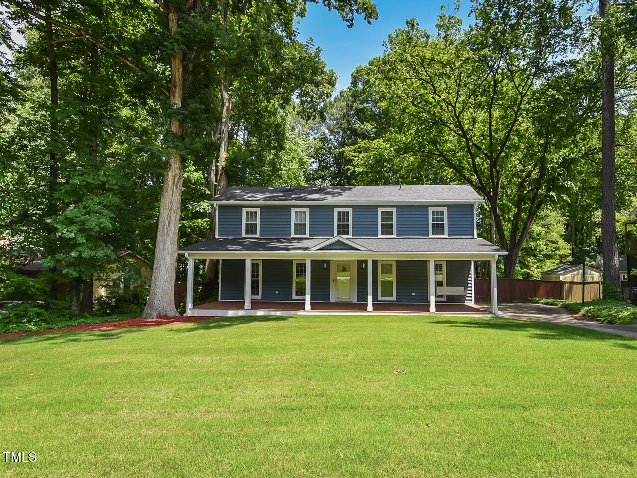 1215 Brookgreen Drive Cary, NC 27511 - Photo 2 of 40 a front view of a house with a garden