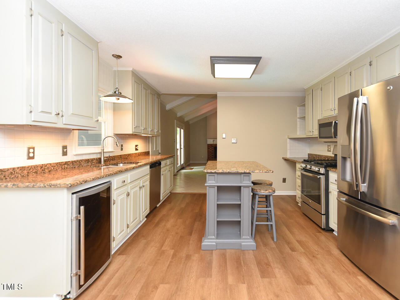 1215 Brookgreen Drive Cary, NC 27511 - Photo 22 of 40 a kitchen with stainless steel appliances granite countertop a stove top oven a sink dishwasher and a refrigerator