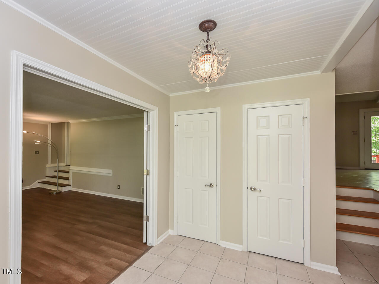1215 Brookgreen Drive Cary, NC 27511 - Photo 27 of 40 a view of a hallway with wooden floor and a bathroom