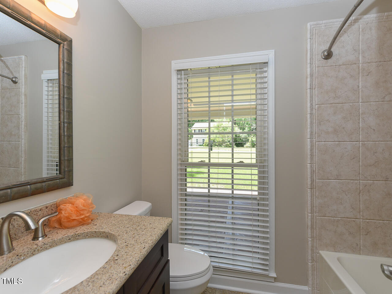 1215 Brookgreen Drive Cary, NC 27511 - Photo 29 of 40 a bathroom with a granite countertop sink toilet and shower