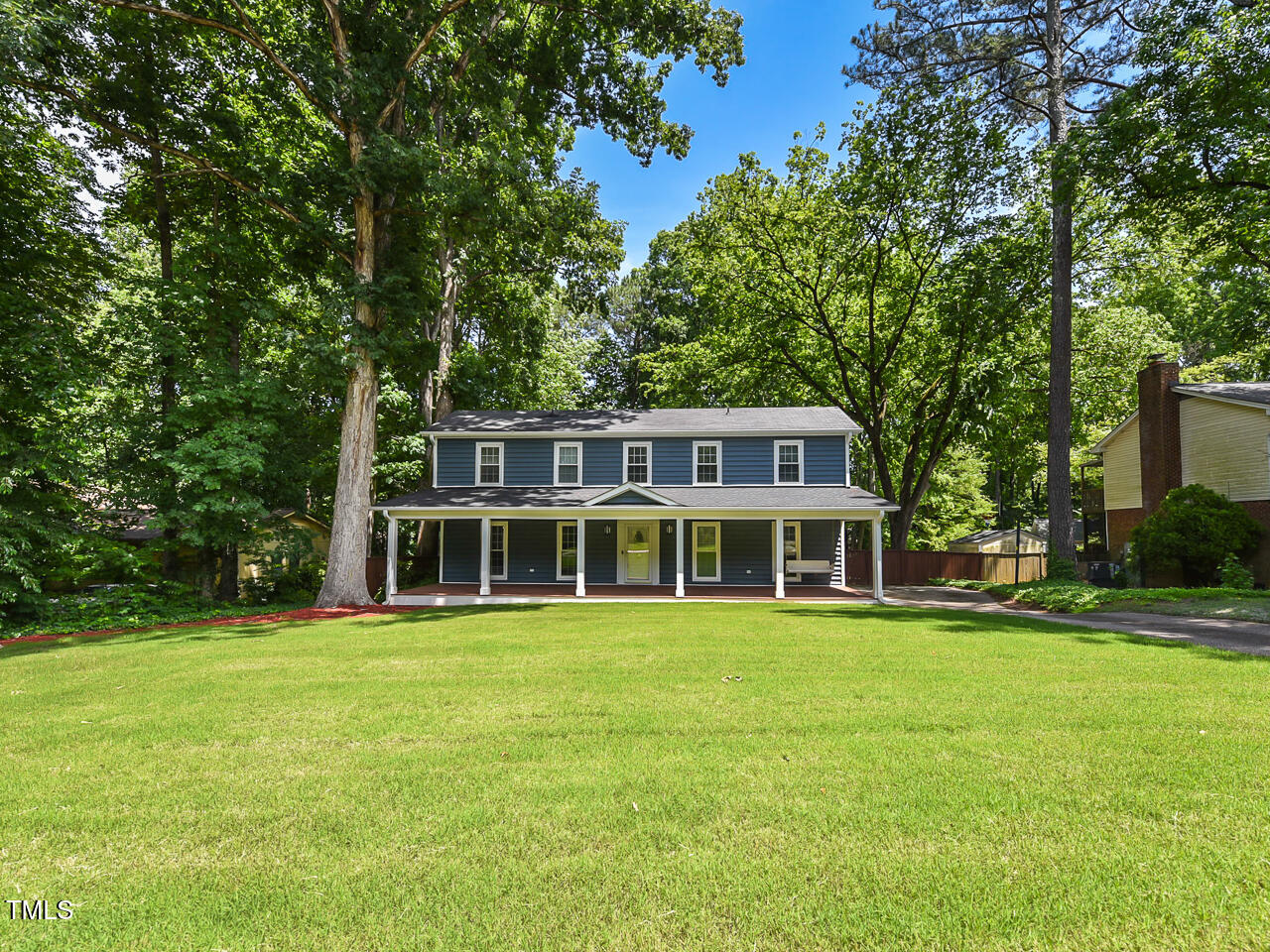 1215 Brookgreen Drive Cary, NC 27511 - Photo 3 of 40 a view of a house with a big yard and large trees
