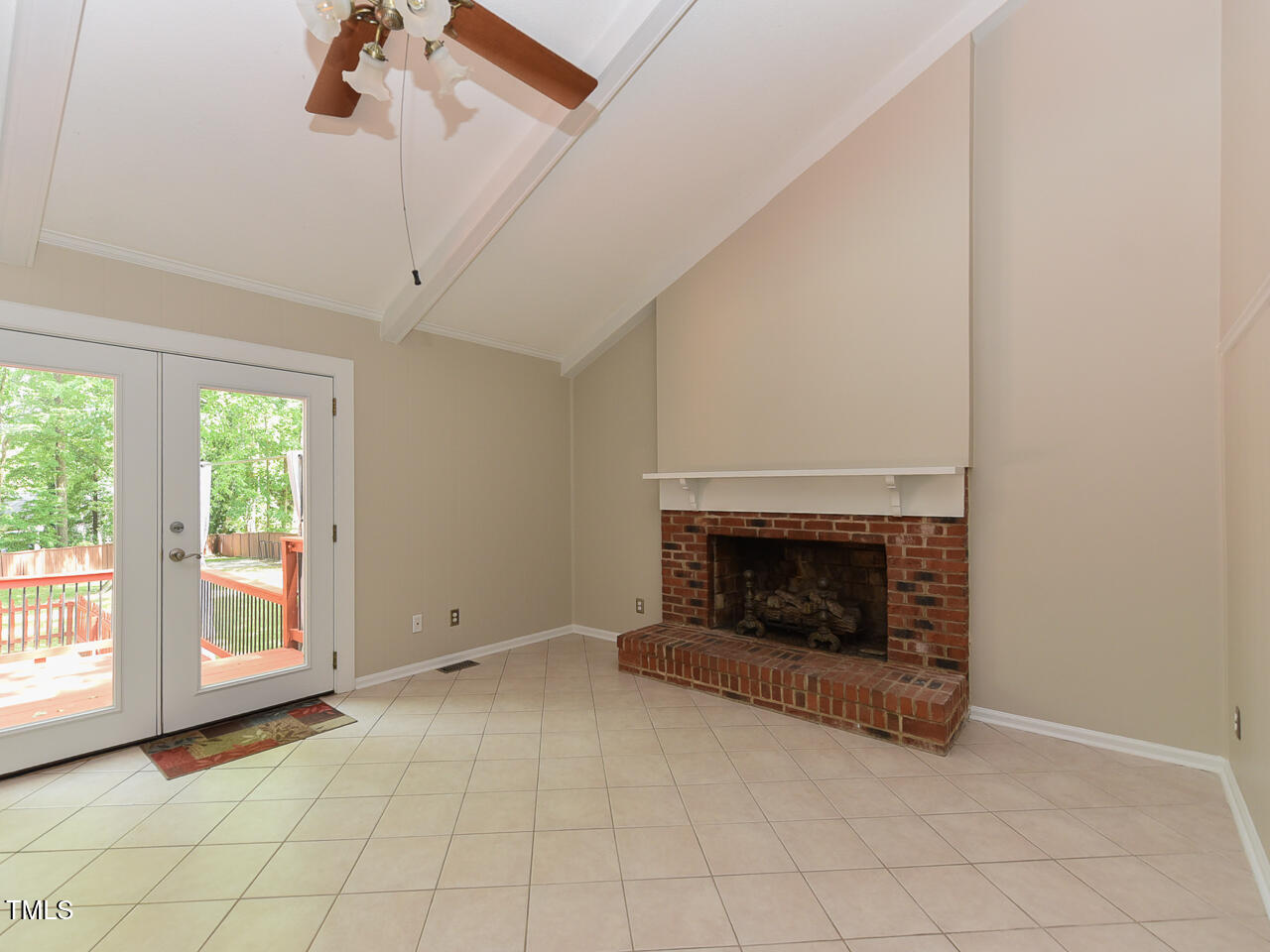 1215 Brookgreen Drive Cary, NC 27511 - Photo 32 of 40 an empty room with windows fireplace and a sink