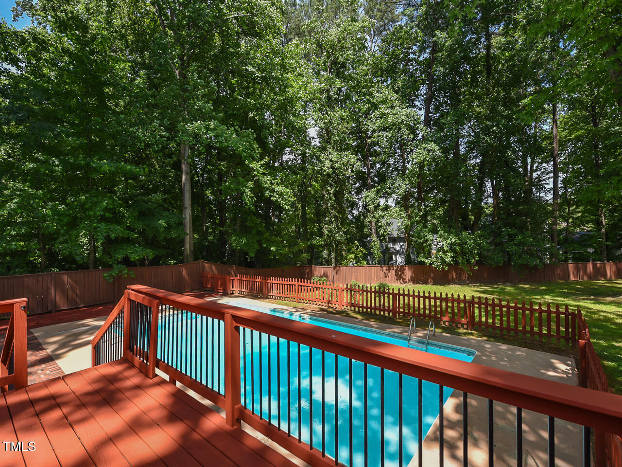 1215 Brookgreen Drive Cary, NC 27511 - Photo 38 of 40 a balcony with wooden floor and trees in the back