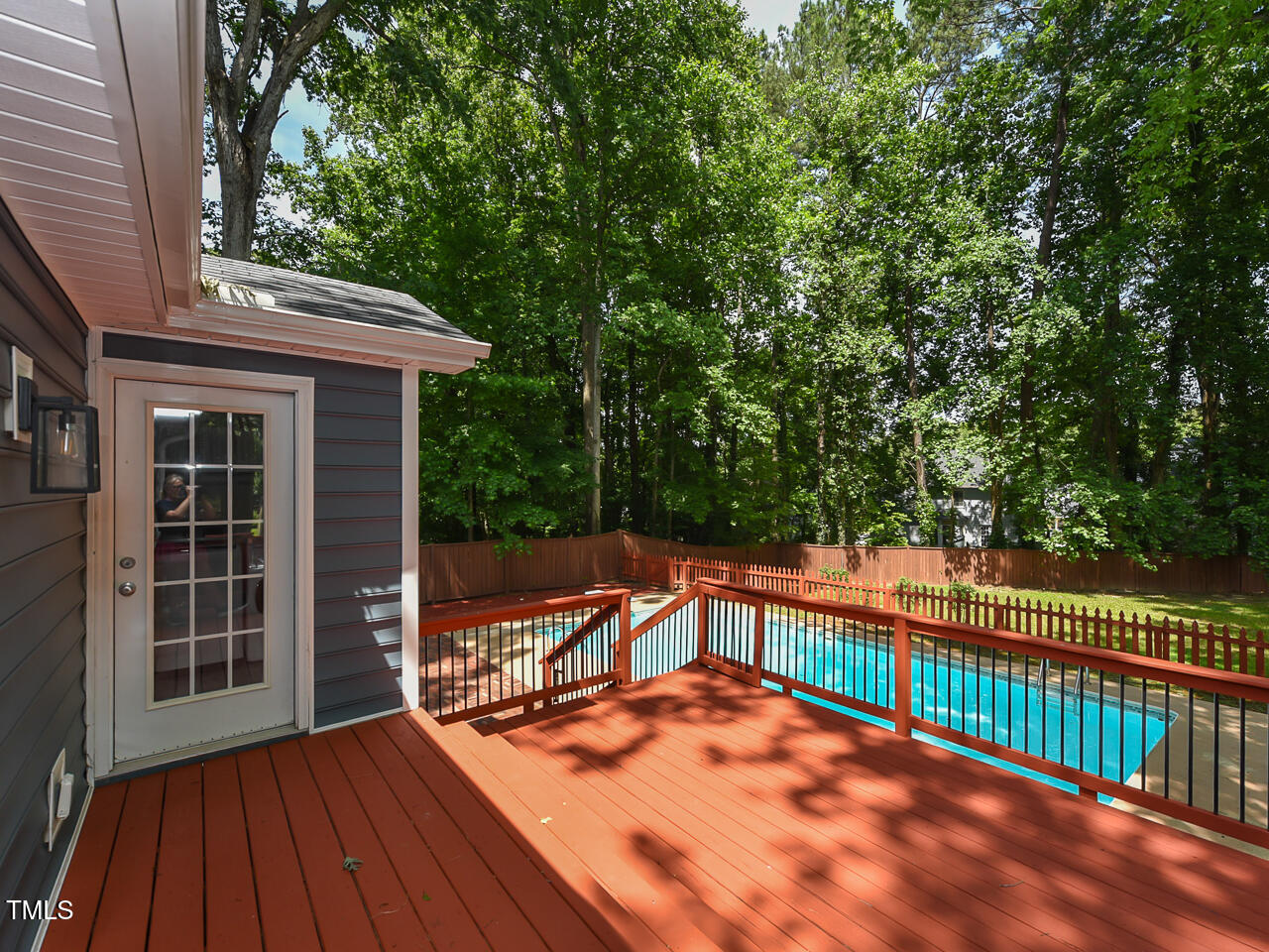 1215 Brookgreen Drive Cary, NC 27511 - Photo 39 of 40 a view of a roof deck with wooden floor and fence