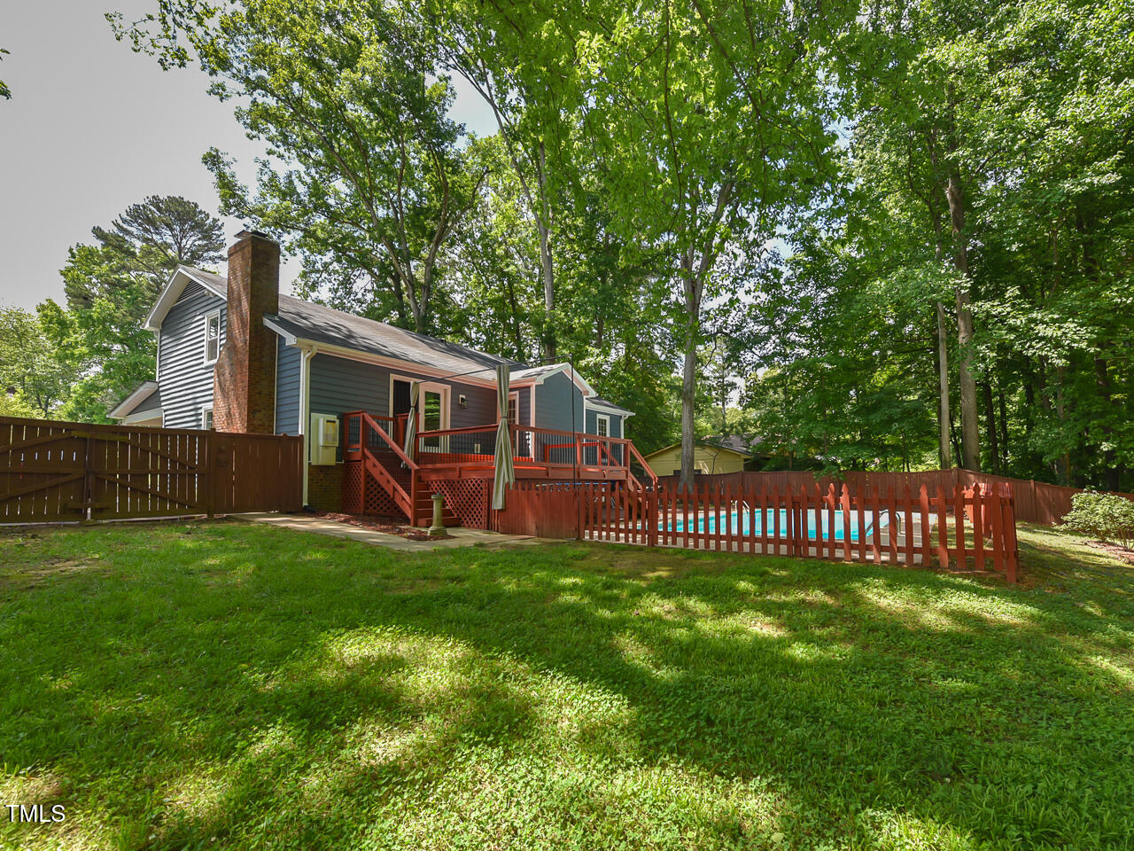 1215 Brookgreen Drive Cary, NC 27511 - Photo 40 of 40 a view of a house with a yard and deck