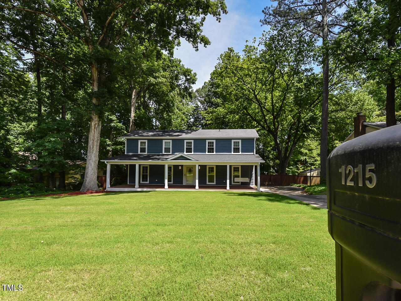 1215 Brookgreen Drive Cary, NC 27511 - Photo 6 of 40 a view of a house with a yard and sitting area