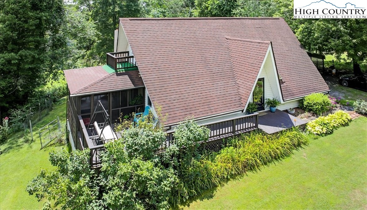 370 Osee Road Sparta, NC 28675 - Photo 1 of 36 a aerial view of a house with garden and plants