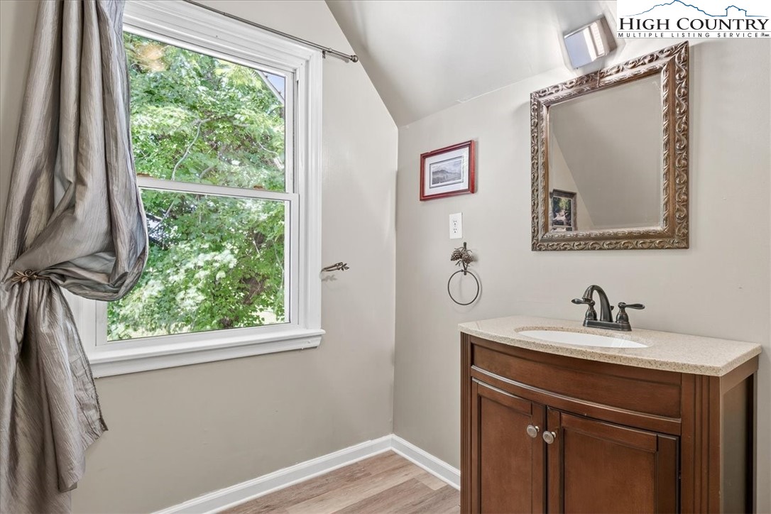 370 Osee Road Sparta, NC 28675 - Photo 11 of 36 a bathroom with a sink and a mirror