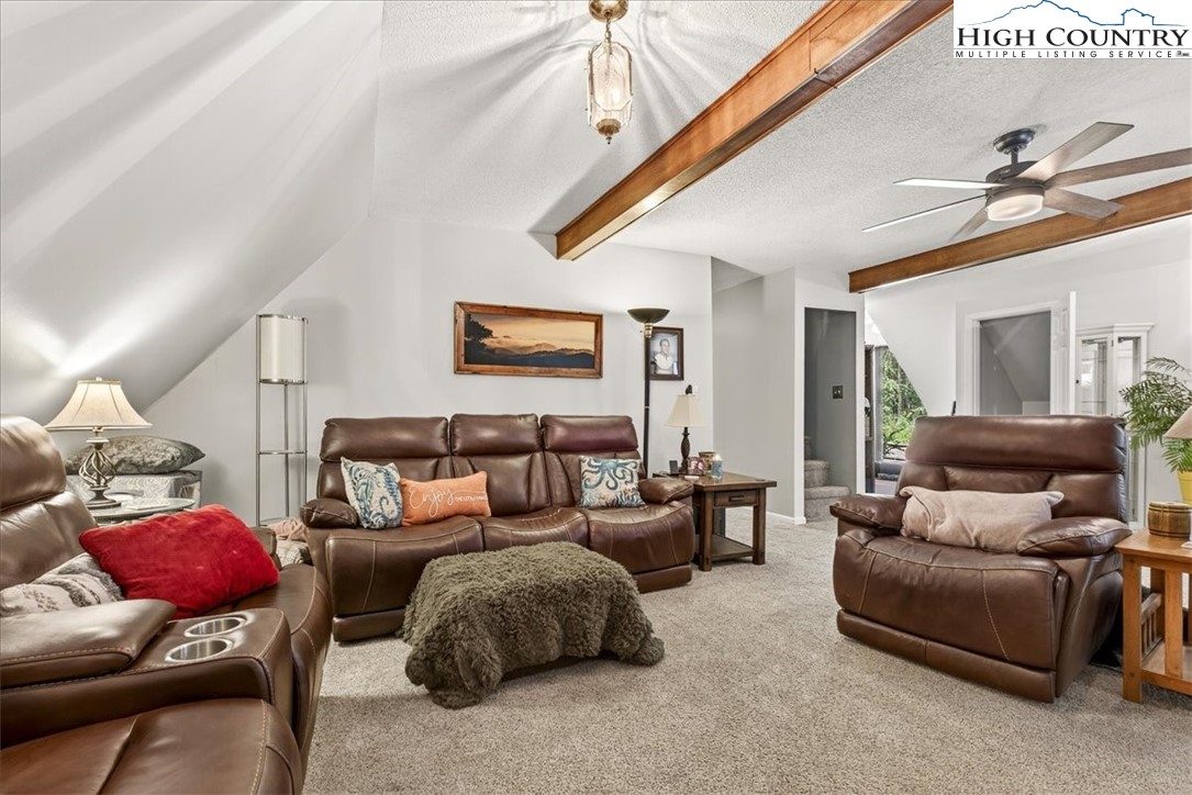 370 Osee Road Sparta, NC 28675 - Photo 14 of 36 a living room with furniture and a ceiling fan