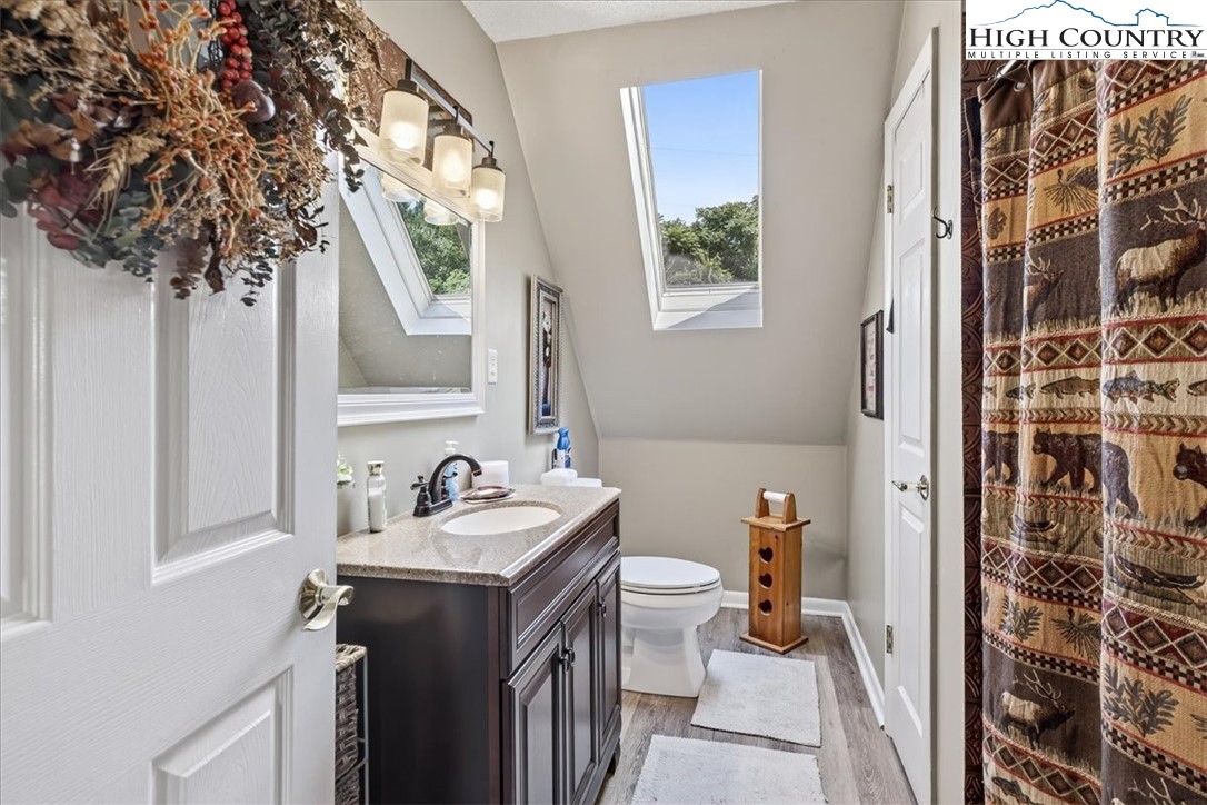 370 Osee Road Sparta, NC 28675 - Photo 19 of 36 a bathroom with a sink and a mirror
