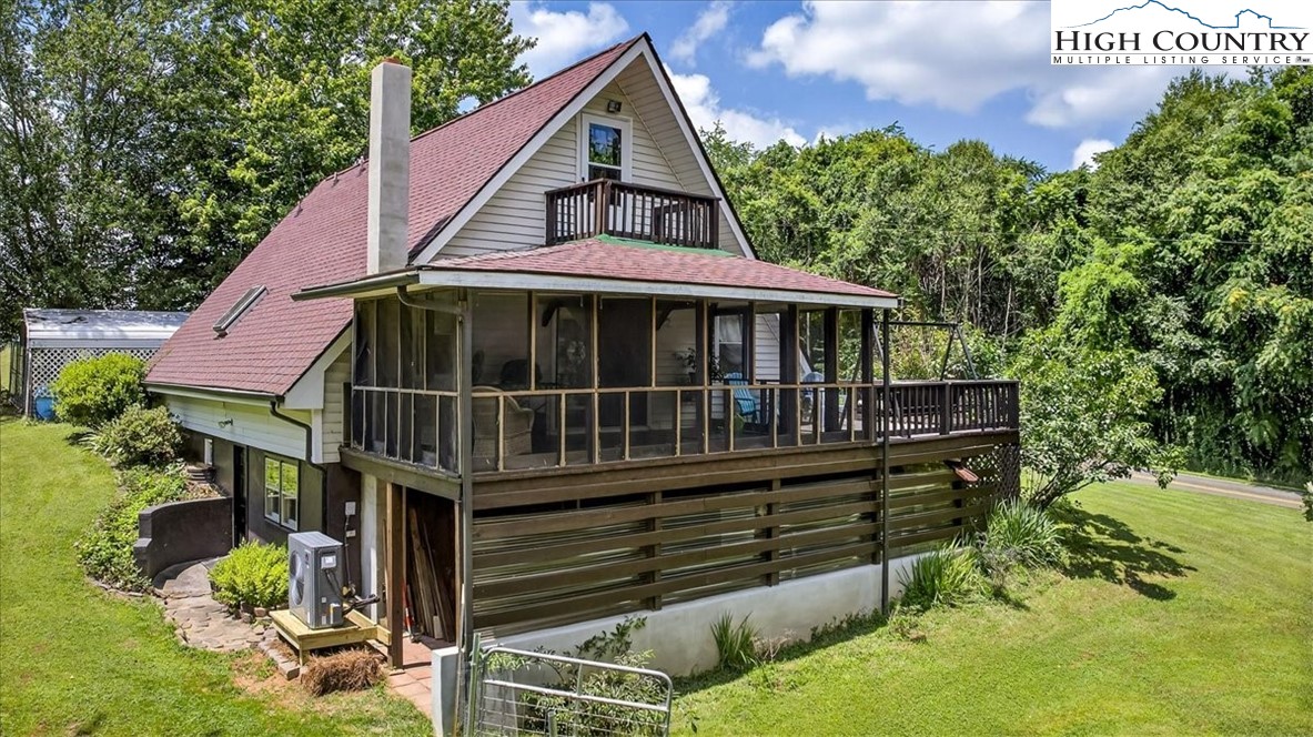 370 Osee Road Sparta, NC 28675 - Photo 2 of 36 a view of house with outdoor seating
