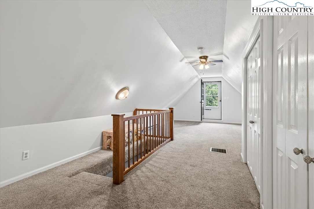 370 Osee Road Sparta, NC 28675 - Photo 21 of 36 a view of a hallway with windows and stairs