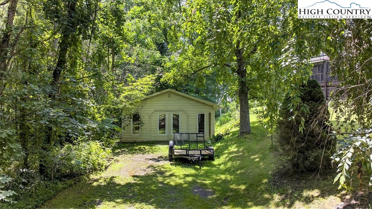 370 Osee Road Sparta, NC 28675 - Photo 29 of 36 a view of backyard of a house with a patio