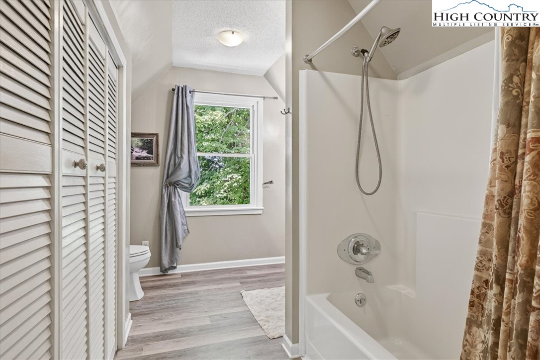 370 Osee Road Sparta, NC 28675 - Photo 10 of 36 a bathroom with a bath tub and shower